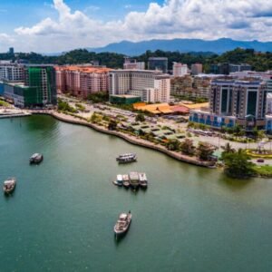 Kota Kinabalu city aerial view above sea level with boats berthi